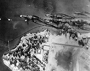 Pearl harbor Battleship row after the attack high level aerial view 80G387565