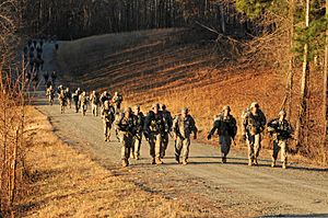 U.S. Soldiers assigned to the 3rd U.S. Infantry Regiment (The Old Guard), conduct a 12-mile road march during Expert Infantryman Badge testing at Fort A.P. Hill, Va., March 22, 2013 130322-A-KF670-299