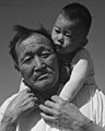 Face detail, Manzanar Relocation Center, Manzanar, California. Grandfather and grandson of Japanese ancestry at . . . - NARA - 537994 (cropped)