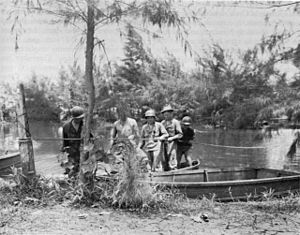 Collapsible assault boats being used by US infantrymen to cross Siwori Creek