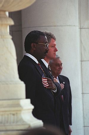 Photograph of President William J. Clinton and Secretary of Veterans Affairs Jesse Brown at the Veterans Day Ceremony in Arlington, Virginia - NARA - 5701121