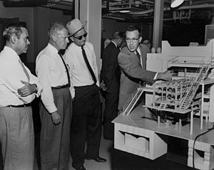 S.R. Sapirie, Senator Albert Gore, Senator Lyndon Johnson, Dr. John Swartout, Looking at Model of Graghite Reactor at Oak Ridge National Lab. (6964225494)
