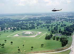 An UH-1 Iroquois helicopter flies over the US Gold Bullion Depository