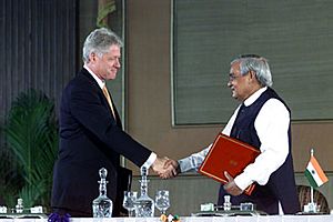 President Bill Clinton and Prime Minister Atal Bihari Vajpayee shake hands after signing a vision statement, Hyderabad House, New Delhi