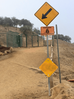 Danger Rattlesnakes sign in Runyon Canyon Park, Los Angeles, California, USA