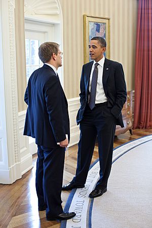 President Barack Obama talks with Press Secretary Jay Carney in the Oval Office, before Carney's press briefing