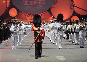 US Navy 090827-N-0773H-269 The U.S. Navy Band along with La Musique du Royal 22e Regiment, marches off during the closing ceremony of the Quebec Tattoo at the Pepsi Coliseum.jpg