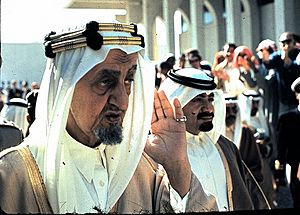King Faisal saluting Saudi troops
