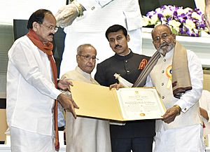 The President, Shri Pranab Mukherjee presenting the Dada Saheb Phalke Award to the Director Shri K. Vishwanath, at the 64th National Film Awards Function, in New Delhi