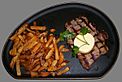 Sirloin steak with garlic butter and french fries cropped.jpg
