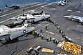 US Navy 110722-N-BR887-022 Sailors move more than ten thousand pounds of mail delivered by two C-2A Greyhound aircraft assigned to Carrier Logistic