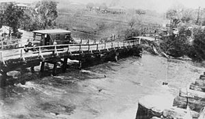 StateLibQld 1 164599 Bus stranded on Old Cleveland Road bridge, Bulimba Creek at Belmont, Brisbane in 1931