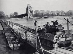 U.S. Army troops cross the Rhine on a heavy pontoon bridge, March 1945