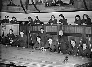WAAF plotters at work in the Operations Room at No. 11 Group HQ at Uxbridge in Middlesex, 1942. CH7698