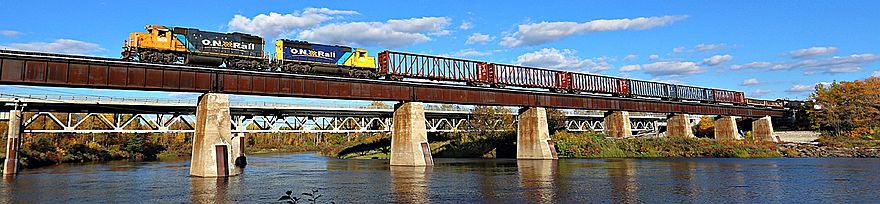 Ontario Northland freigh train crossing the Missinaibi River at Mattice-Val Côté in Northern Ontario