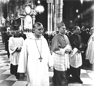 Frère Roger (center) and Franz Kardinal König (right) leaving Vienna's St. Stephen's Cathedral after oecumenical church service