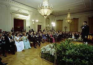 Opera Singer Sherrill Milnes Receiving Applause from the Audience following His Performance during the Entertainment Portion of a State Dinner Honoring Prime Minister Malcolm Fraser of Australia - NARA - 12007045