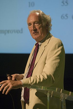 Colour photograph of Gordon McVie giving a lecture