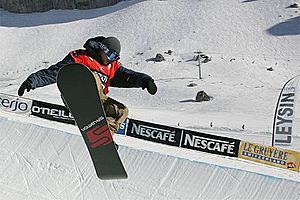Snowboarder in halfpipe