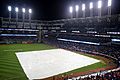The tarp is on the field during the 10th inning of World Series Game 7. (30746057685)