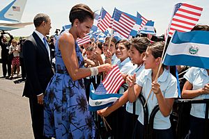 Barack and Michelle Obama greet children during the arrival ceremony at Comalapa International Airport in San Salvador, 2011