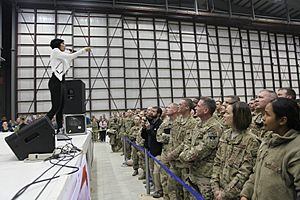 Bridget Kelly, on stage, a Grammy-winning singer and songwriter, performs for U.S. Service members during the 2013 USO Chairman's Holiday Tour at Bagram Airfield in Parwan province, Afghanistan, Dec. 9, 2013 131209-A-NQ567-131