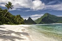 A white sand beach and verdant peaks