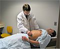 Standardized-Patient-Program-examining-t he-abdomen