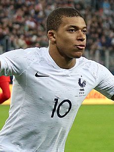 Kylian Mbappe celebrating - March 2018 (cropped)