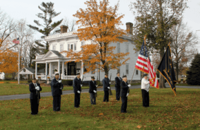 Members of American Legion Post #294 in front of the Wolcott House, the Italianate home of town founder Anson Wolcott.