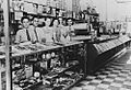 Staff behind the counter of Logos Brothers’ Central Cafe and Store, Blackall, ca. 1939