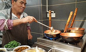 Mixian Rice Noodles Being Prepared in Copper Pots