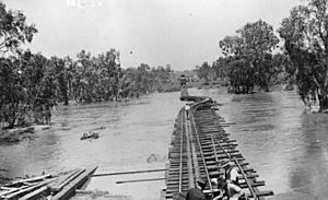 StateLibQld 1 78999 Carry bridge going over a flooded river on the Great Northern Railway line, 1930s
