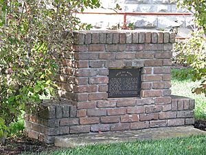 Marker composed of bricks from Macon's birthplace