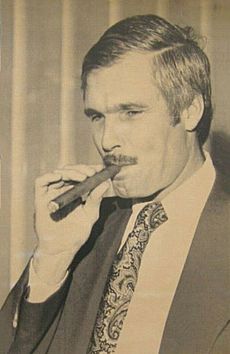 Ted Turner smoking a cigar