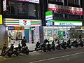 A 7 Eleven sits right next to a FamilyMart store in Taipei