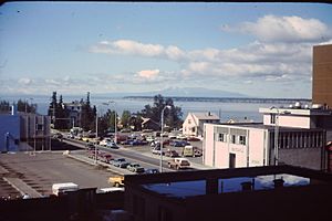 Buildings, cars, bay Anchorage 1976