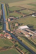 Aerial shot of the canal, with the Austen warehouse central