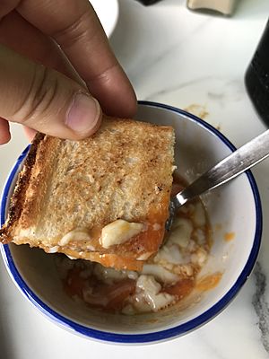 Kaya toast dip into soft boiled egg