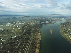 Aerial view of Kennewick from above the Columbia River near the Blue Bridge.