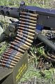A close up of 0.50 Caliber (12.7 mm) Browning Ball M33 Ammunition loaded onto a Browning M2 HB 0.50 caliber heavy machine