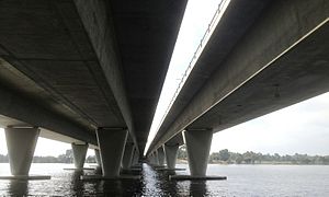 View from under a six-lane road bridge over the Swan River next to a smaller railway bridge