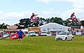 Morcycle jumping at a country fair (England) arp