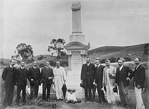 StateLibQld 2 290879 Group photograph of Linda Memorial Committee at the Monument, Mt. Morgan, 1909
