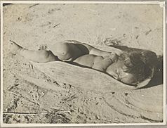 Aboriginal child asleep in a wooden dish, central Australia, ca. 1940s (8718150313)