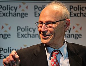 Hirsch smiling while speaking