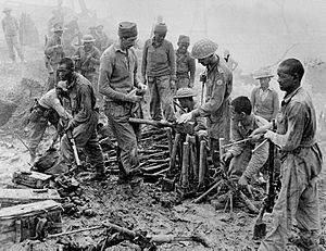 Indian and Gurkha soldiers inspect captured Japanese ordnance during the Imphal-Kohima battle, 1944