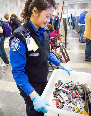 TSA Officer Carrying Prohibited Items