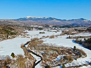 Aerial view of Underhill & Mt Mansfield, over the Browns River looking east towards Underhill Center (upper right)