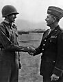 Lt. Ernest Childers, a Creek, being congratulated by Gen. Jacob L. Devers after receiving the Congressional Medal of Hon - NARA - 535783restoredh